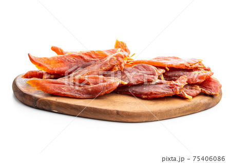 Dried chicken meat. Tasty jerky meat. 75406086
