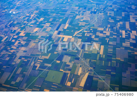 Daytime view from a flying plane over fields and land shares 75406980