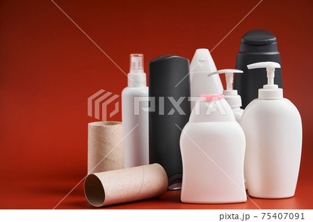 A set of empty clean plastic containers of different shapes from household cleaning products, shower supplies and toilet paper cardboard tube A set of empty clean plastic containers of different shapes from household cleaning products, shower supplies and toilet paper cardboard tube 75407091