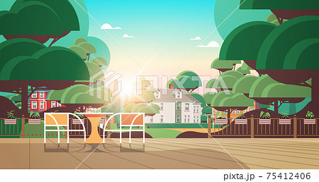 beautiful backyard terrace with chairs and table sunset cityscape background horizontal 75412406