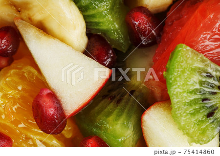 Pieces of raznfh fruit close-up in full screen, Fruit salad. 75414860