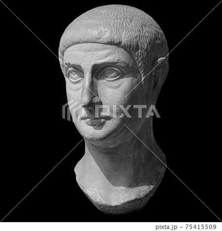 Head detail of the ancient man sculpture. Stone face isolated on black background. Antique marble statue of mythical hero character Head detail of the ancient man sculpture. Stone face isolated on black background. Antique marble statue of mythical hero character 75415509