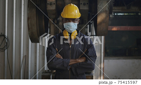 engineer remove mask from face at work in industry factory 75415597
