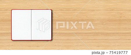 Red open lined notebook isolated on wooden background. Horizontal banner Red open lined notebook isolated on wooden background. Horizontal banner 75419777