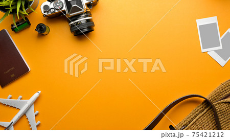 Travel concept, mock up creative scene with passport, camera, photo card frame, bag and copy space Travel concept, mock up creative scene with passport, camera, photo card frame, bag and copy space 75421212