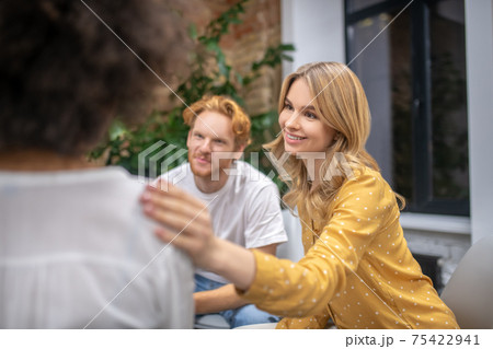 Group members supporting each other and looking friendly Group members supporting each other and looking friendly 75422941
