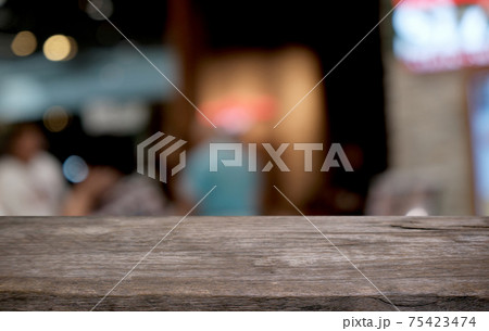 Empty dark wooden table in front of abstract blurred bokeh background of restaurant . can be used for display or montage your products.Mock up for space. 75423474