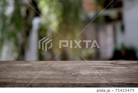 Empty dark wooden table in front of abstract blurred bokeh background of restaurant . can be used for display or montage your products.Mock up for space. Empty dark wooden table in front of abstract blurred bokeh background of restaurant . can be used for display or montage your products.Mock up for space. 75423475