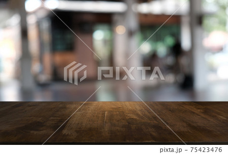 Empty dark wooden table in front of abstract blurred bokeh background of restaurant . can be used for display or montage your products.Mock up for space. 75423476