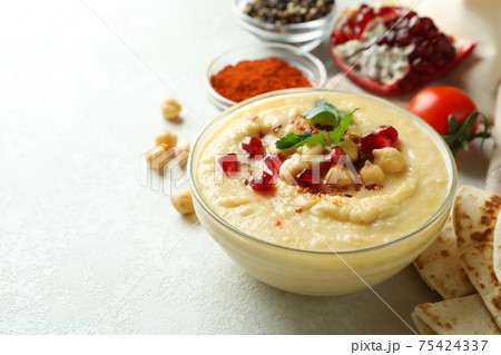Concept of cooking hummus on white textured background 75424337