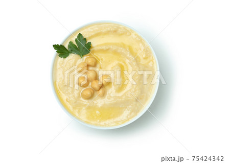 Bowl of fresh hummus isolated on white background Bowl of fresh hummus isolated on white background 75424342