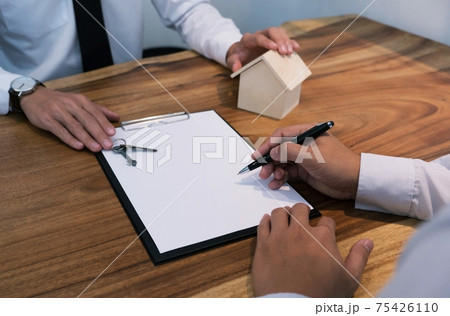 business man signing contract making a deal with real estate agent Concept for consultant. business man signing contract making a deal with real estate agent Concept for consultant. 75426110
