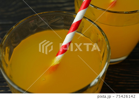 Glasses of orange soda on wooden background 75426142