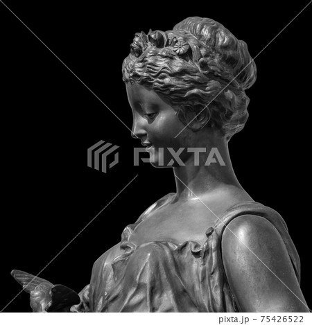 Ancient white marble sculpture head of young woman. Statue of sensual renaissance art era woman antique style. Face isolated on black background 75426522