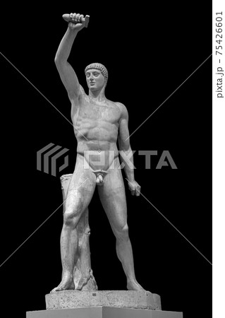 Ancient white marble full length sculpture of naked male with hammers. Antique classic statue of worker isolated on black. Stone figure of athlete 75426601