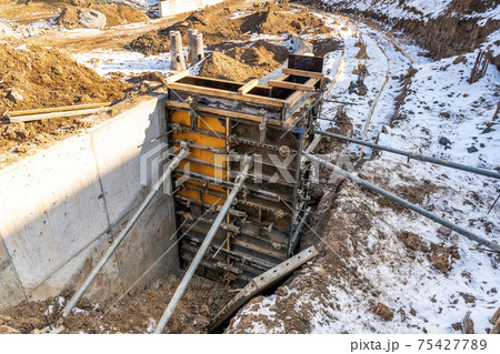 Construction work in winter season 75427789