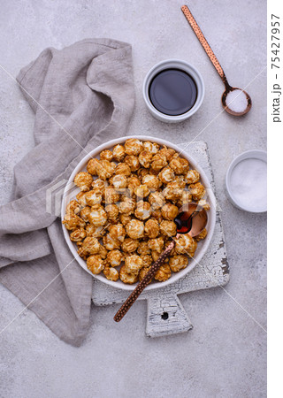 Salted caramel popcorn in bowl Salted caramel popcorn in bowl 75427957
