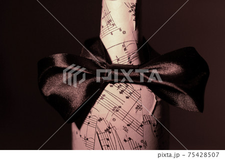 festively decorated bottle of wine.isolated on a dark background festively decorated bottle of wine.isolated on a dark background 75428507