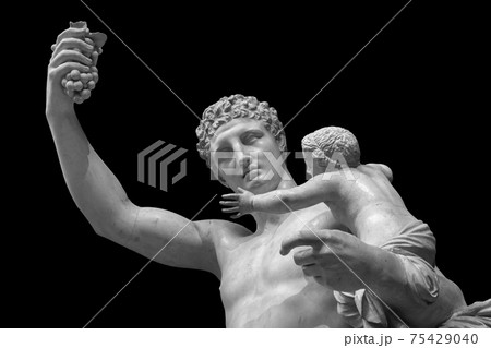 Statue of Dionysus or Bacchus with bunch of grapes isolated on black Statue of Dionysus or Bacchus with bunch of grapes isolated on black 75429040