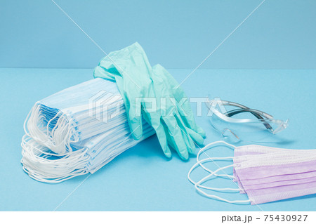 Latex gloves, masks and safety glasses for personal protection. Latex gloves, masks and safety glasses for personal protection. 75430927