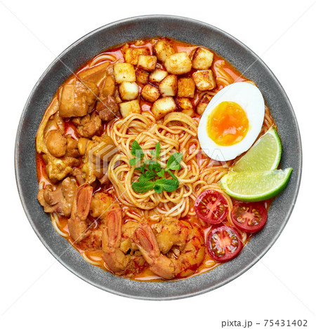Laksa in gray bowl isolated on white. Coconut noodle peranakan cuisine curry soup Laksa in gray bowl isolated on white. Coconut noodle peranakan cuisine curry soup 75431402