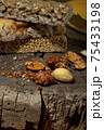 Kozinaki of sesame on the wooden background 75433198
