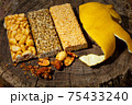 Kozinaki of sesame on the wooden background 75433240