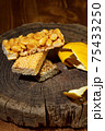 Kozinaki of sesame on the wooden background 75433250