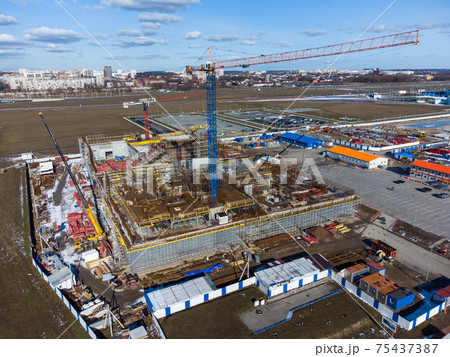 Crane on construction site in outskirts 75437387