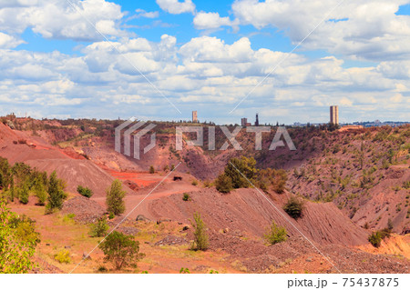 View of huge iron ore quarry in Kryvyi Rih, Ukraine. Open pit mining 75437875