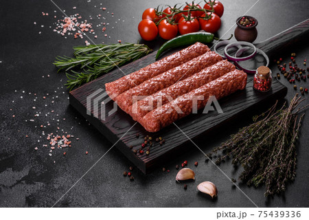 Fresh raw mince for grilled kebab with spices and herbs Fresh raw mince for grilled kebab with spices and herbs 75439336
