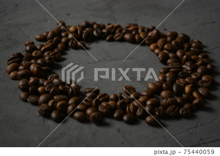 coffee beans on a grey surface 75440059