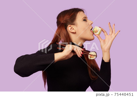 woman with sushi 75440451