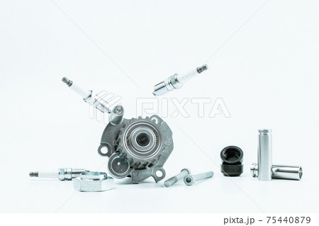 Car motor parts. Auto motor mechanic spare or automotive piece on white background. Set of new metal car part. Repair and vehicle service. Car motor parts. Auto motor mechanic spare or automotive piece on white background. Set of new metal car part. Repair and vehicle service. 75440879