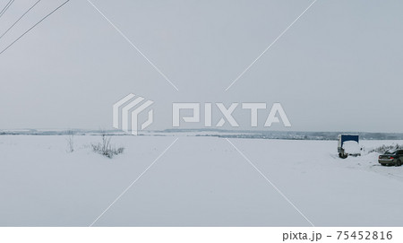 Winter frosty landscape of the river with broken ice 75452816