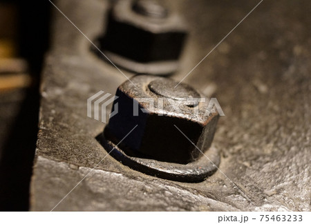 Nut and bolt close up with shallow Dof 75463233