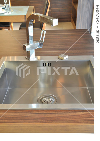 Interior of modern kitchen and stainless steel sink, tap and drain 75470044
