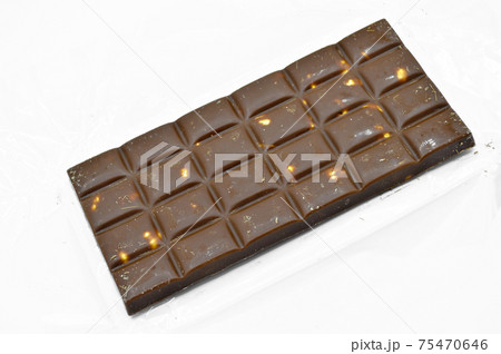 Delicious chocolate bar with milk and hazelnut, isolated on white background 75470646