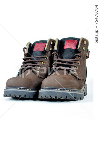 Hiking shoes and a white background, Sturdy hiking boots Hiking shoes and a white background, Sturdy hiking boots 75470704