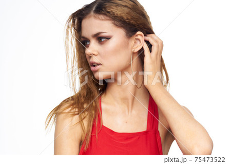 Woman with wavy hair red tank top cosmetics lifestyle model 75473522