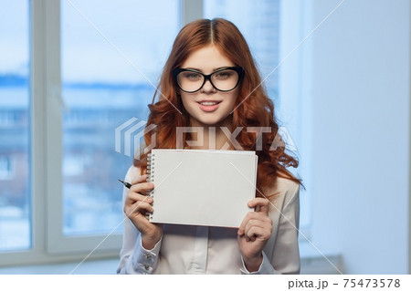 Business woman in office holding notepad in hands of documents Professional manager 75473578