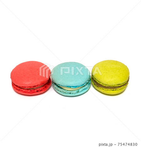 Red Blue Yellow Macaroons isolated in white background. Colorful french macarons close-up. Tasty sweet color macaroon, bakery concept.  75474830