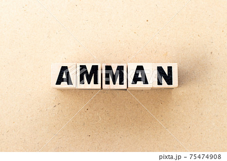 Alphabet letter block in word amman on wood background Alphabet letter block in word amman on wood background 75474908
