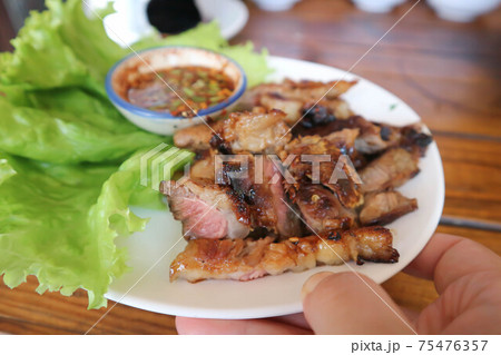grilled beef , roasted beef or beef steak 75476357