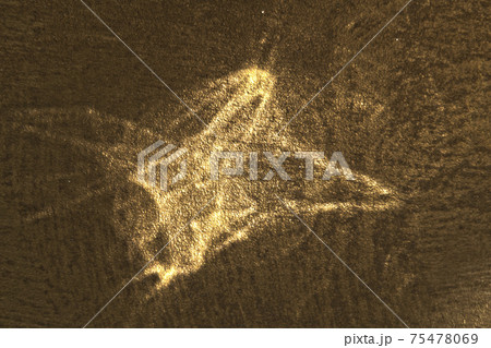 Reflected sun glare on a golden coarse grained surface, abstraction, background 75478069