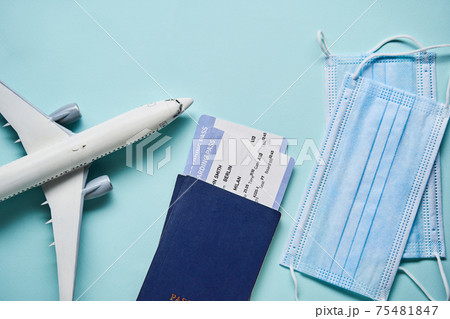 Plane mode, tickets and mask. Resuming flight travel concept due coronavirus pandemic. 75481847