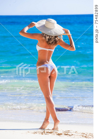 Woman on beach 75482899