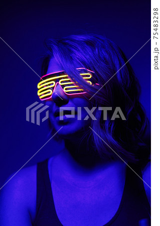 Cyberpunk style portrait of beautiful young woman in futuristic costume. 75483298