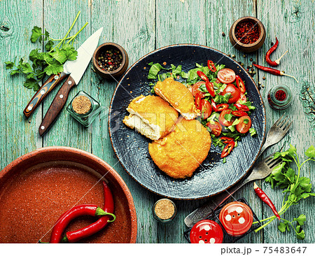 Chicken kiev cutlet with salad Chicken kiev cutlet with salad 75483647