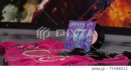 Retro Vinyl records music background near the superhero wall audio disc Retro Vinyl records music background near the superhero wall audio disc 75486012